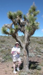 Margaret with a big cactus and Isla's drawing -small.JPG